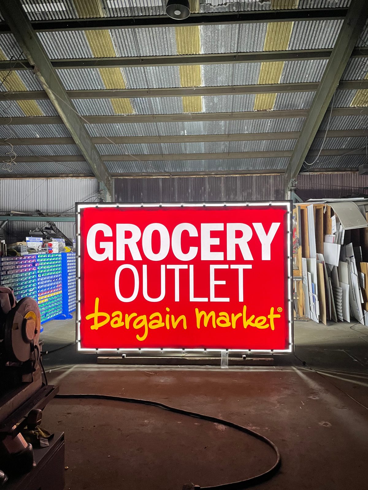 Illuminated cabinet lightbox sign for Grocery Outlet Bargain Market